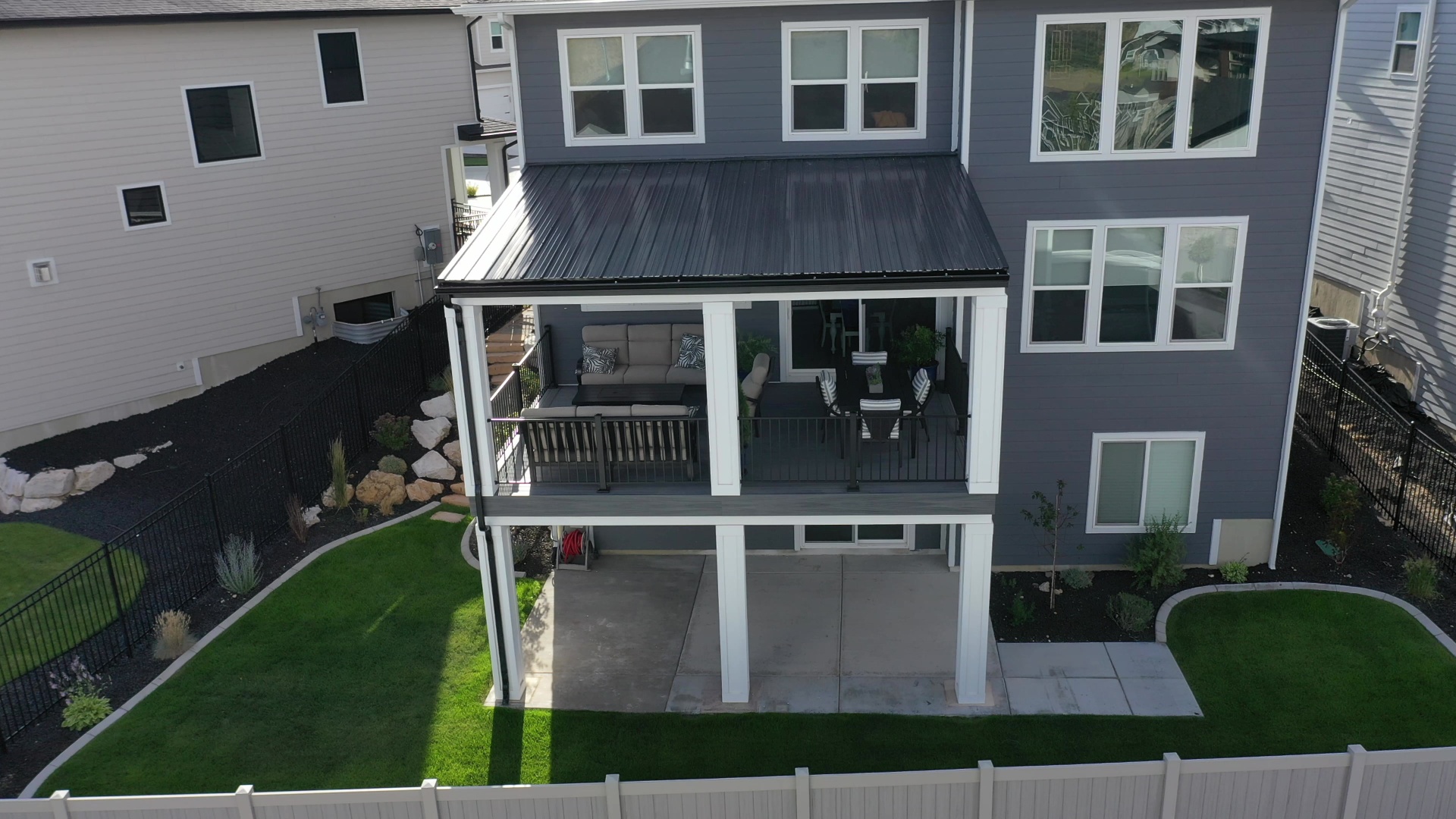 Covered deck rear elevation on two-story home