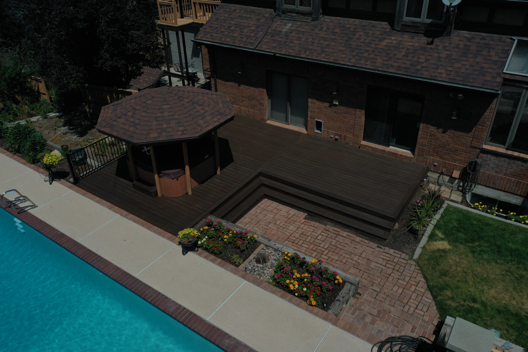 Poolside composite deck with gazebo cover